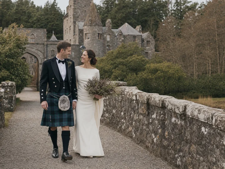 A couple wearing coordinated Highland wedding attire